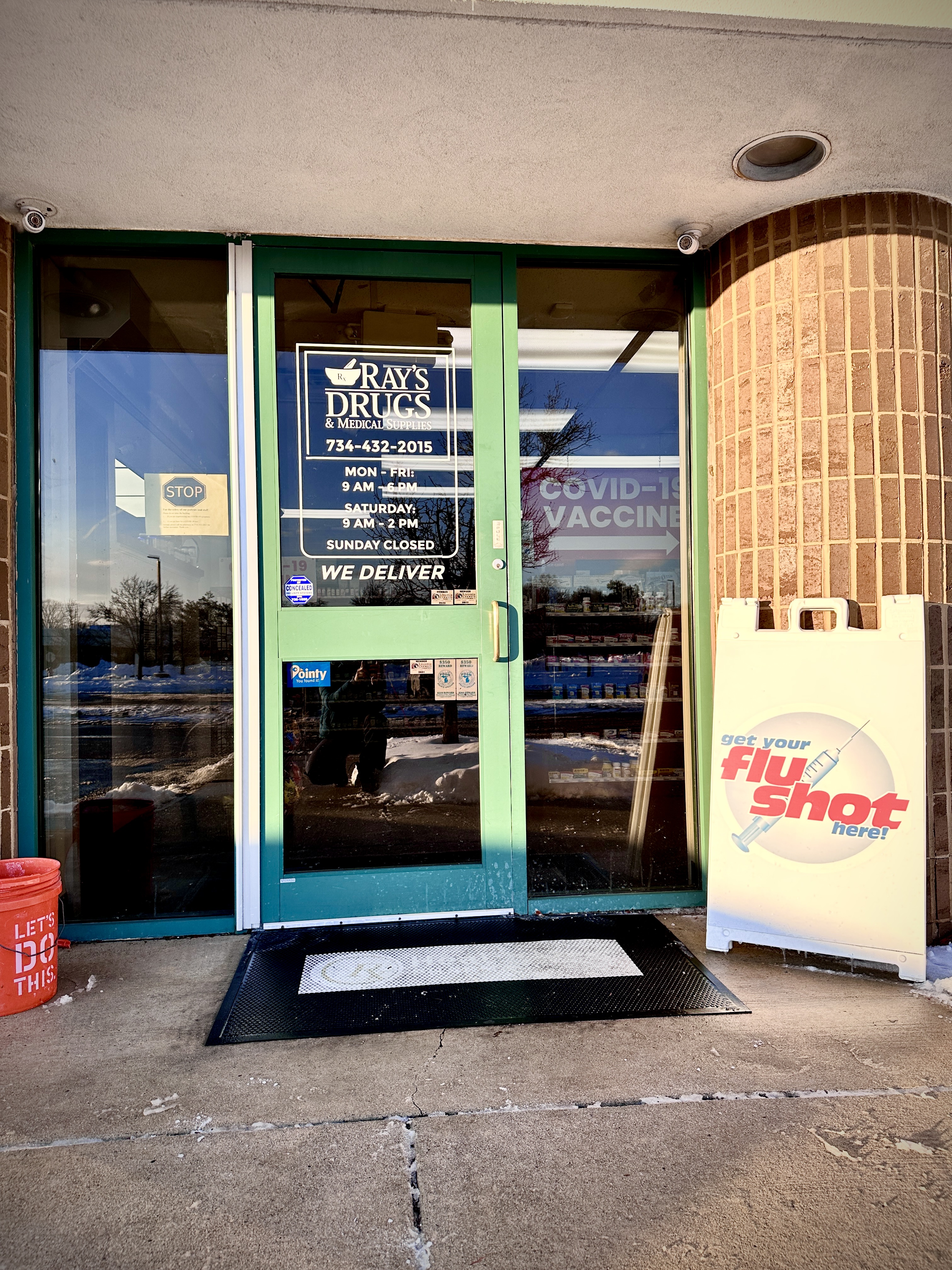 Pharmacist consulting with a patient at Ray's Drugs